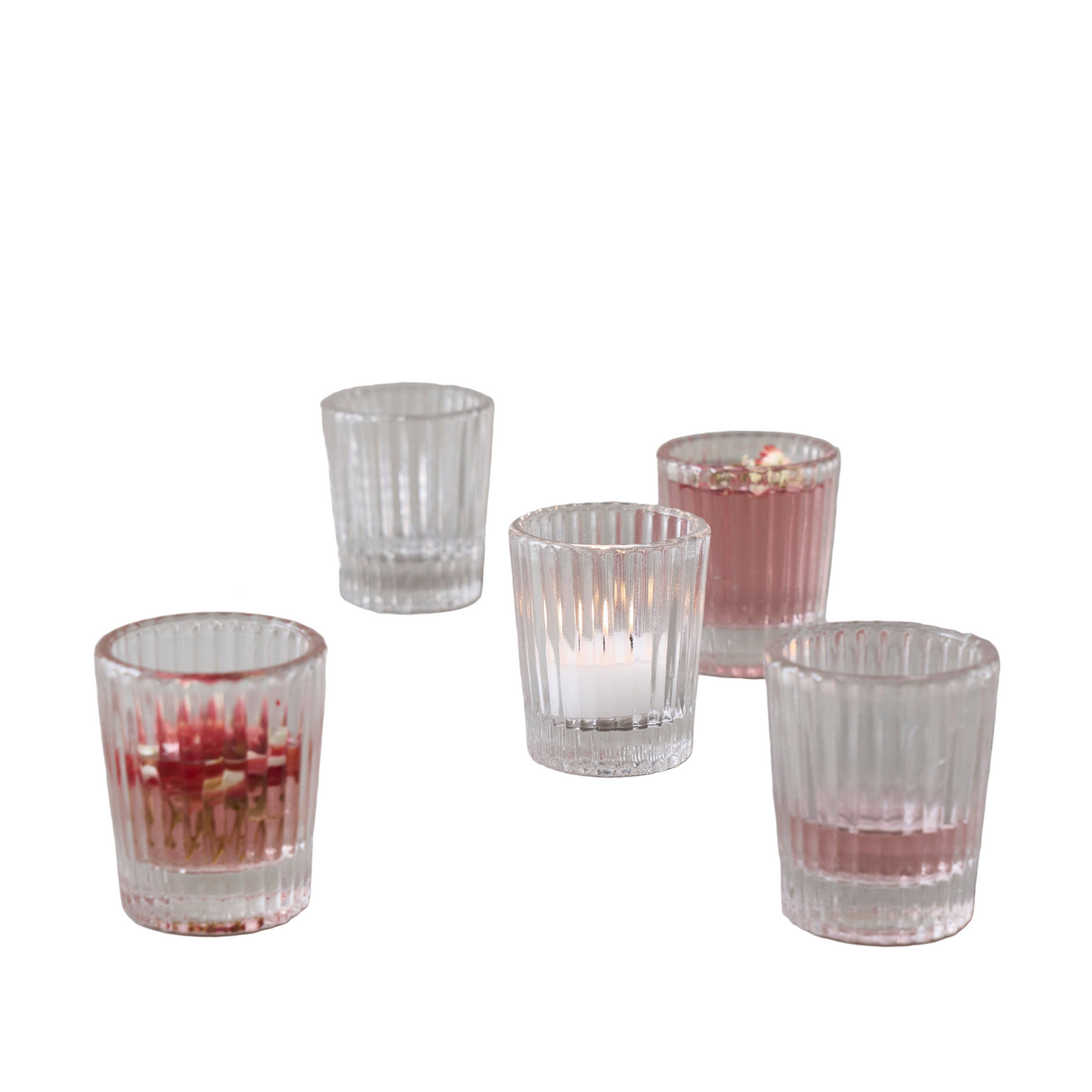 Set of five shot glasses with a white background