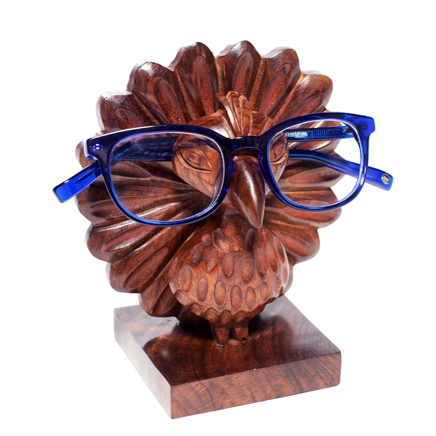 Wooden flower sculpture wearing blue glasses on a white background