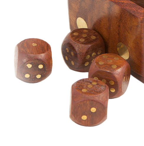 Set of wooden dice with gold pips on a white background