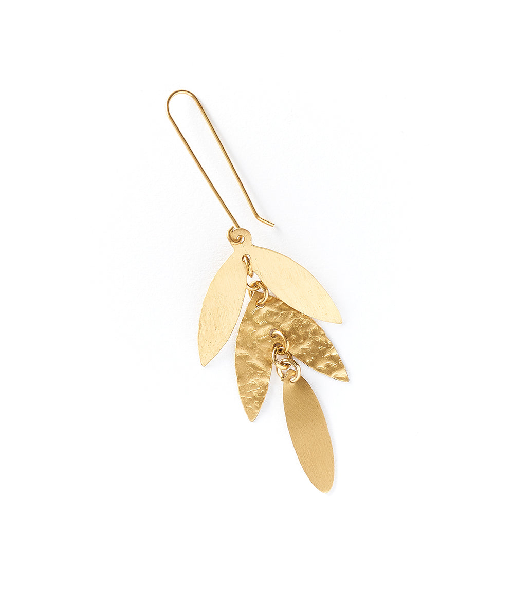 Gold feather-shaped earring on a white background