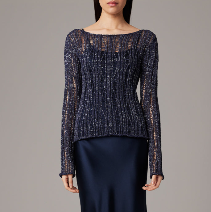 Navy blue textured sweater worn by a model on a gray background