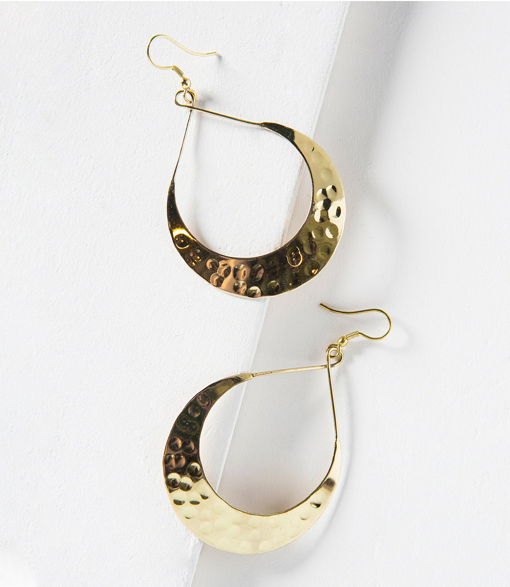 Pair of gold hoop earrings on a white background