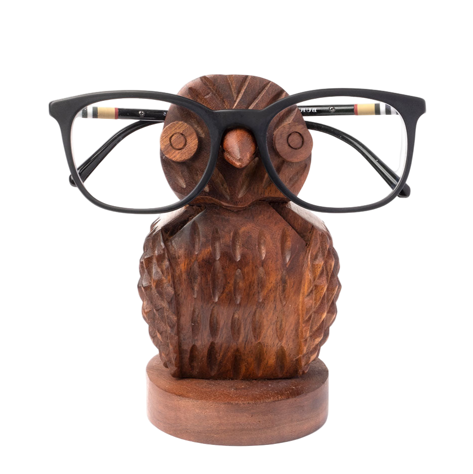 Wooden owl-shaped eyeglass holder with glasses on a white background