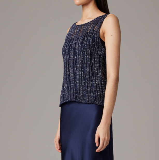Navy blue sleeveless top worn by a person on a gray background