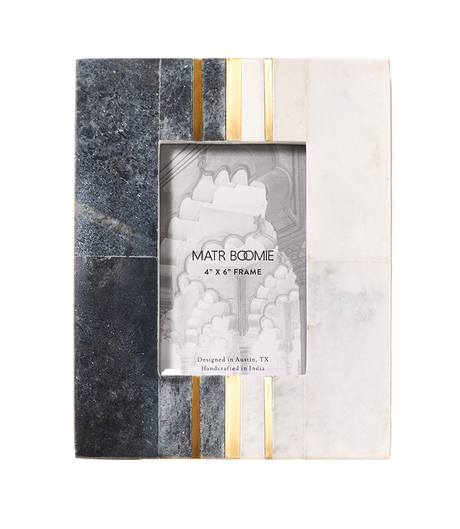 Marble-patterned photo frame with gold accents on a white background