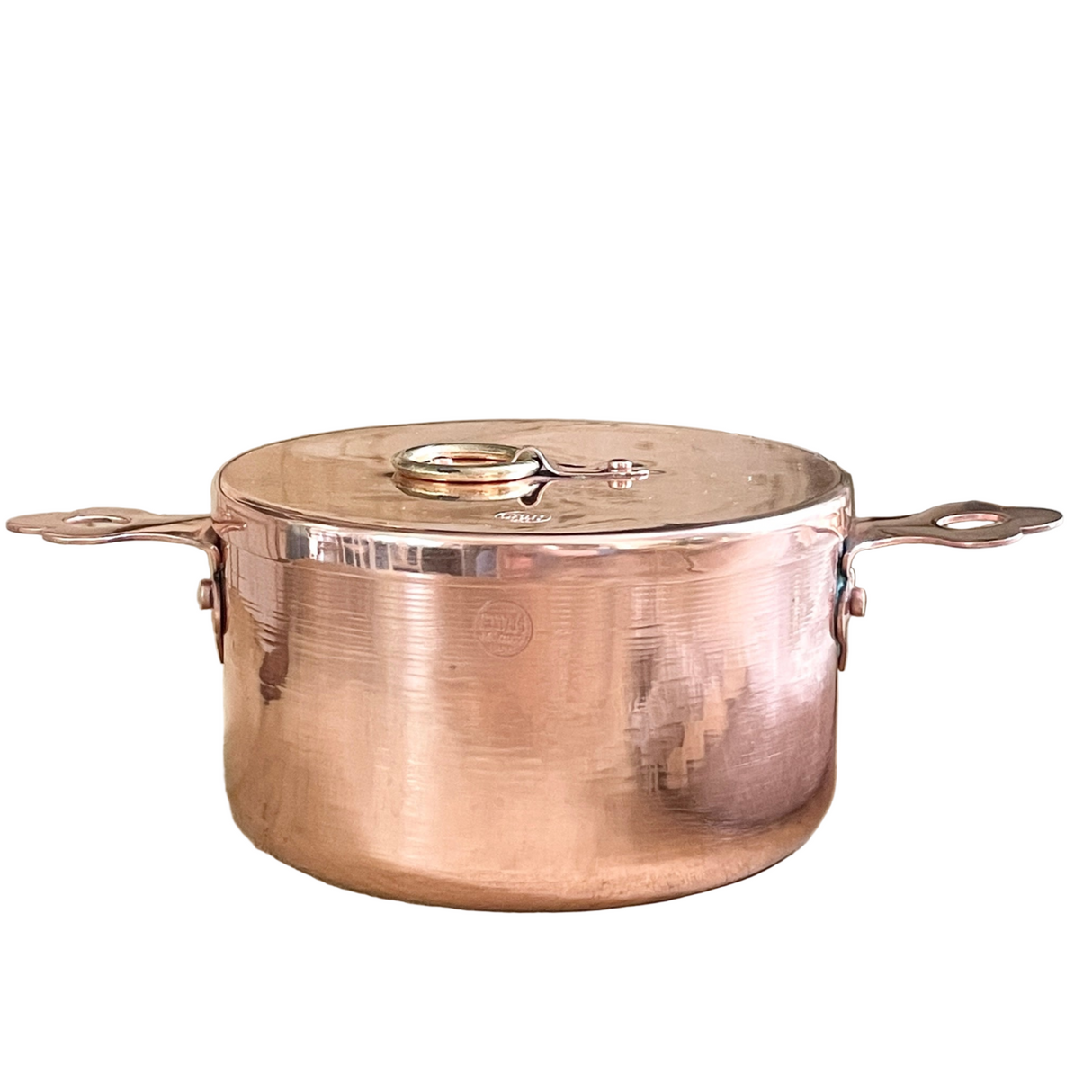 Copper pot with lid on a white background