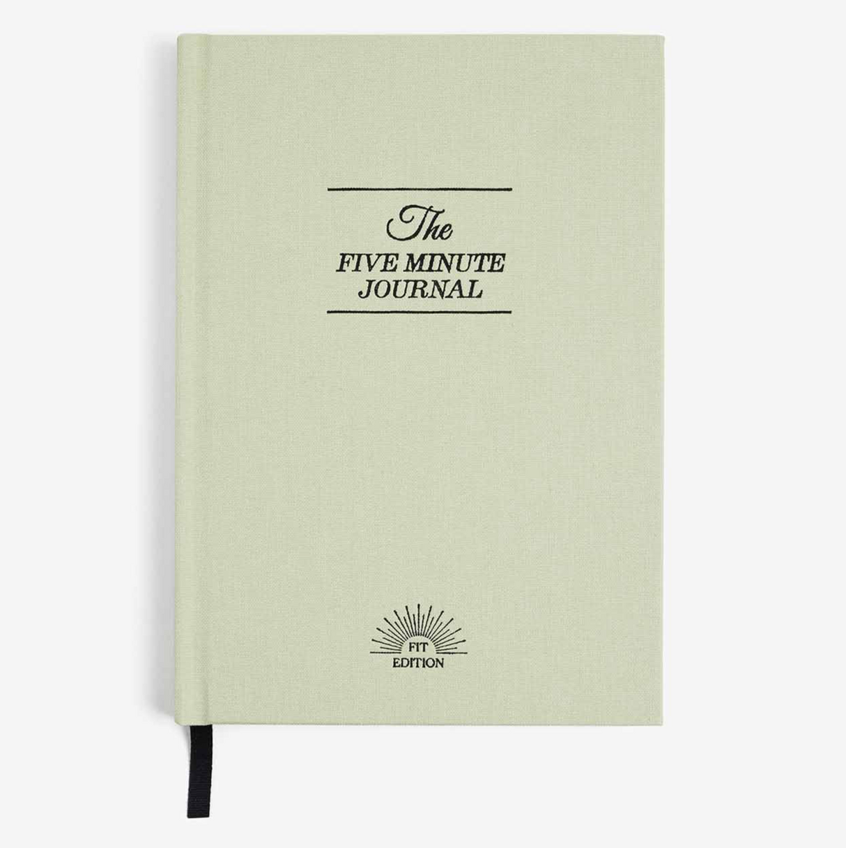 Light green journal with 'The Five Minute Journal' text on a white background
