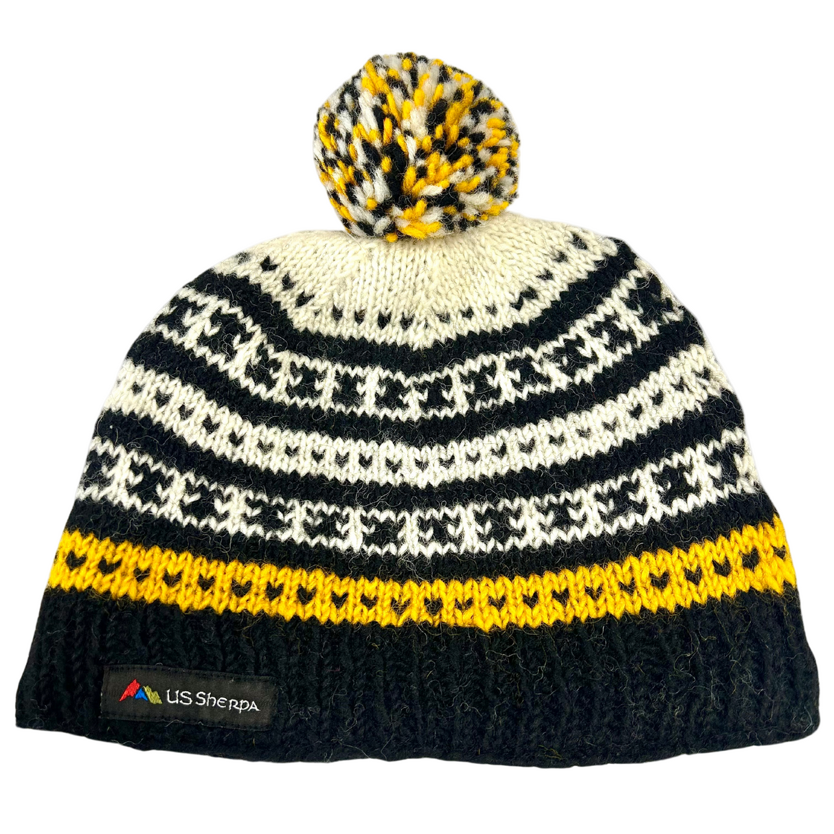 Knitted beanie with black, white, and yellow pattern on a white background