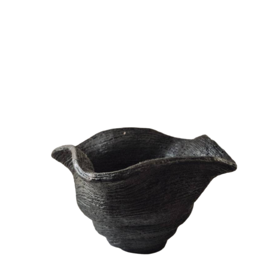 Black ceramic bowl on a white background