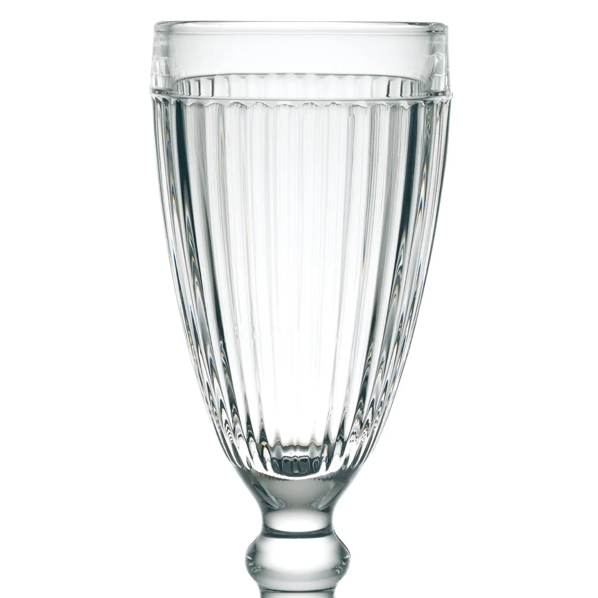 A clear, ribbed glass goblet from the La Rochere Antillaise Ice Cream Cup Set of 6, with a classic design reminiscent of timeless cups, filled with water.