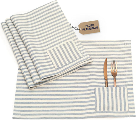 Set of striped cloth placemats with cutlery on a white background
