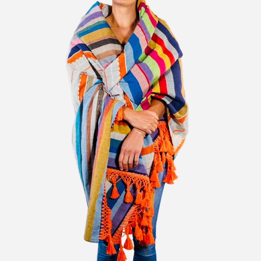 Colorful striped scarf with tassels on a white background