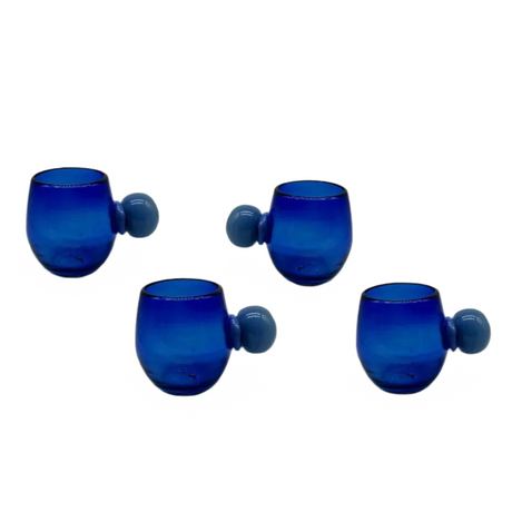 Set of four blue glass tumblers with gray handles on a white background