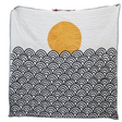 Quilt with yellow sun and black wave patterns on a white background