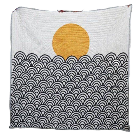 Quilt with yellow sun and black wave patterns on a white background