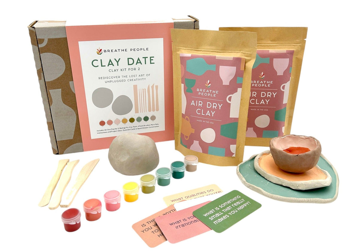 Clay date kit with air dry clay, tools, and coloring options on a white background