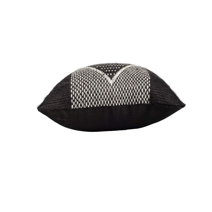 Black and white patterned pillow on a gray background