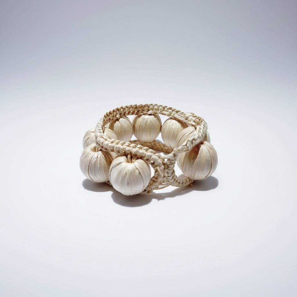 napkin ring made of woven beads on a white background