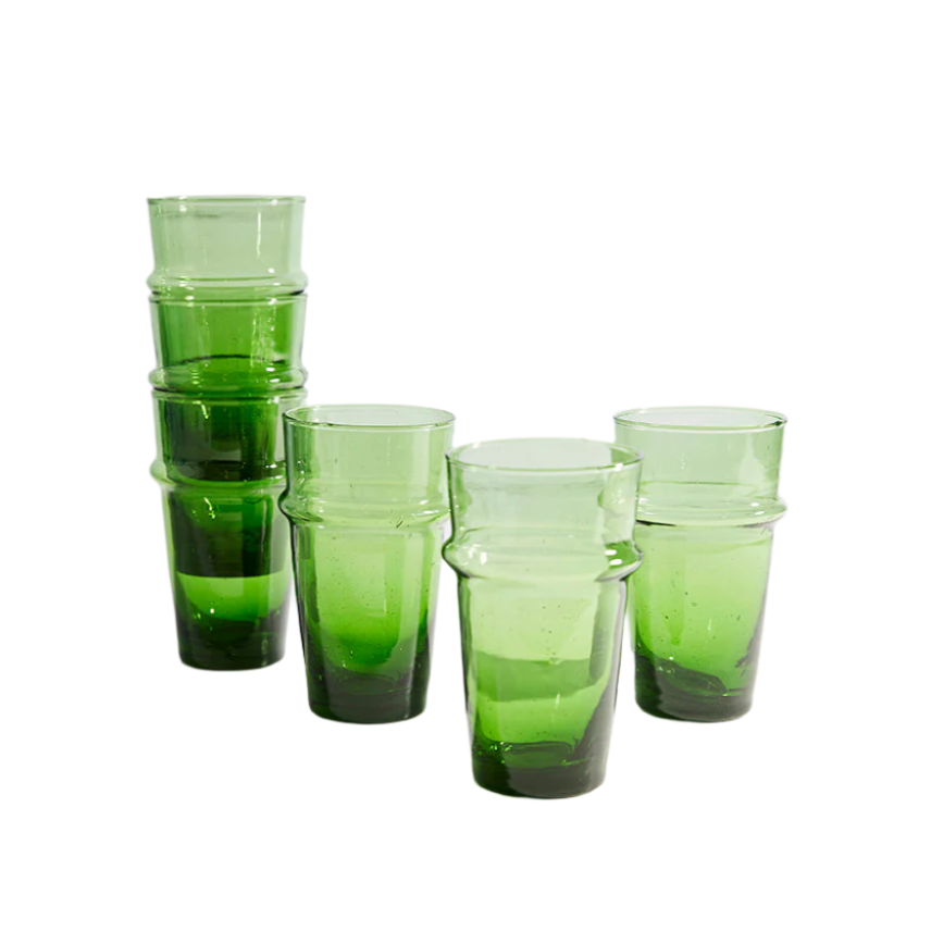 Stack of green tumblers on a white background