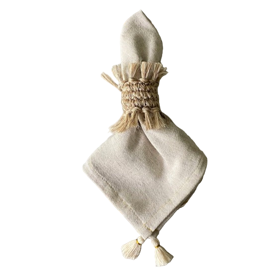 Beige fabric napkin with tassels on a white background