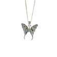 Butterfly-shaped pendant on a chain against a white background