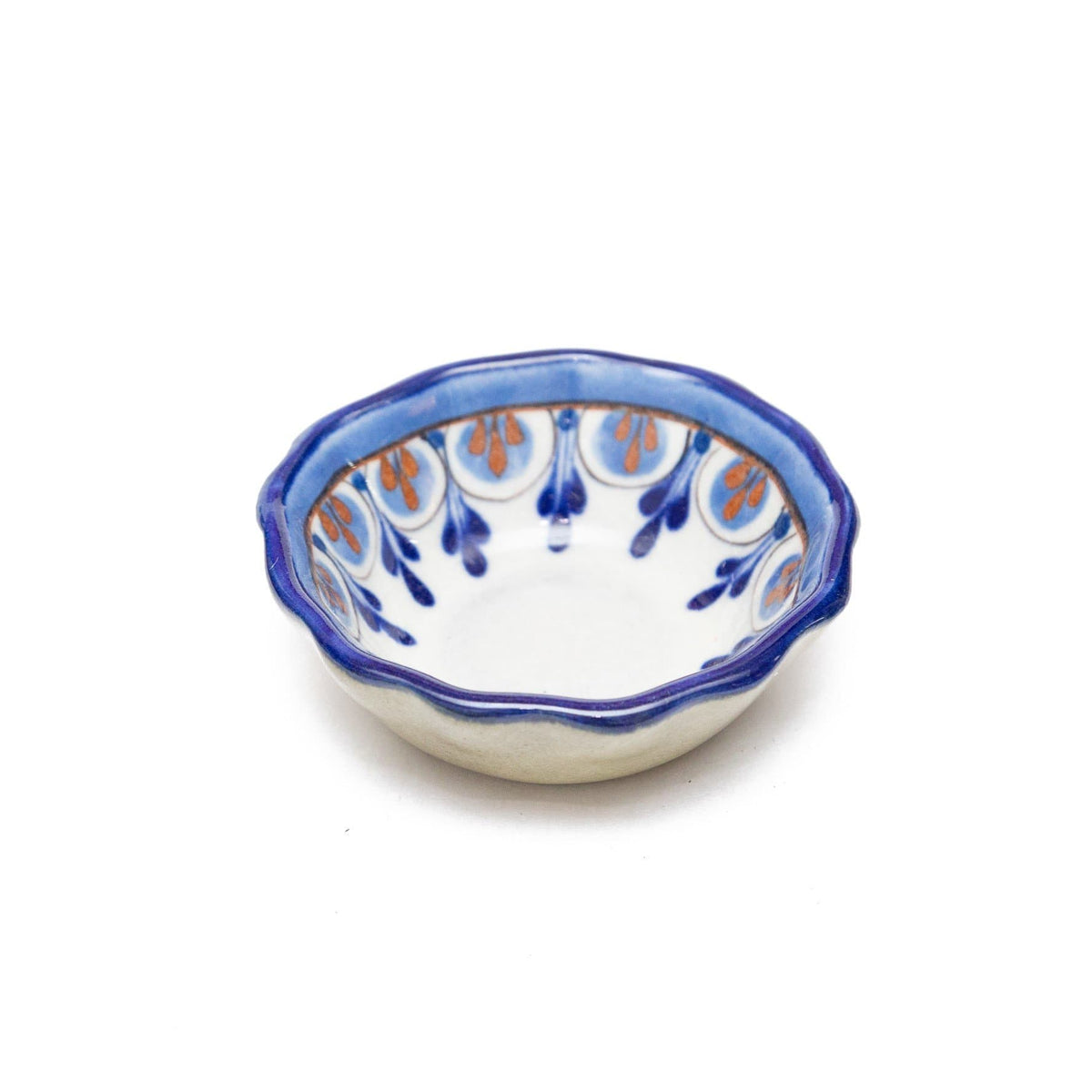 Ceramic bowl with blue and orange pattern on a white background