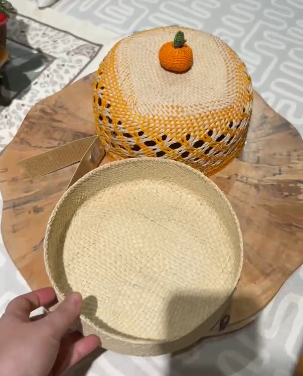 Bread Basket with a small pumpkin decoration, on a wooden surface.