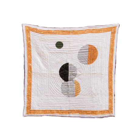 Quilt with geometric pattern on a white background