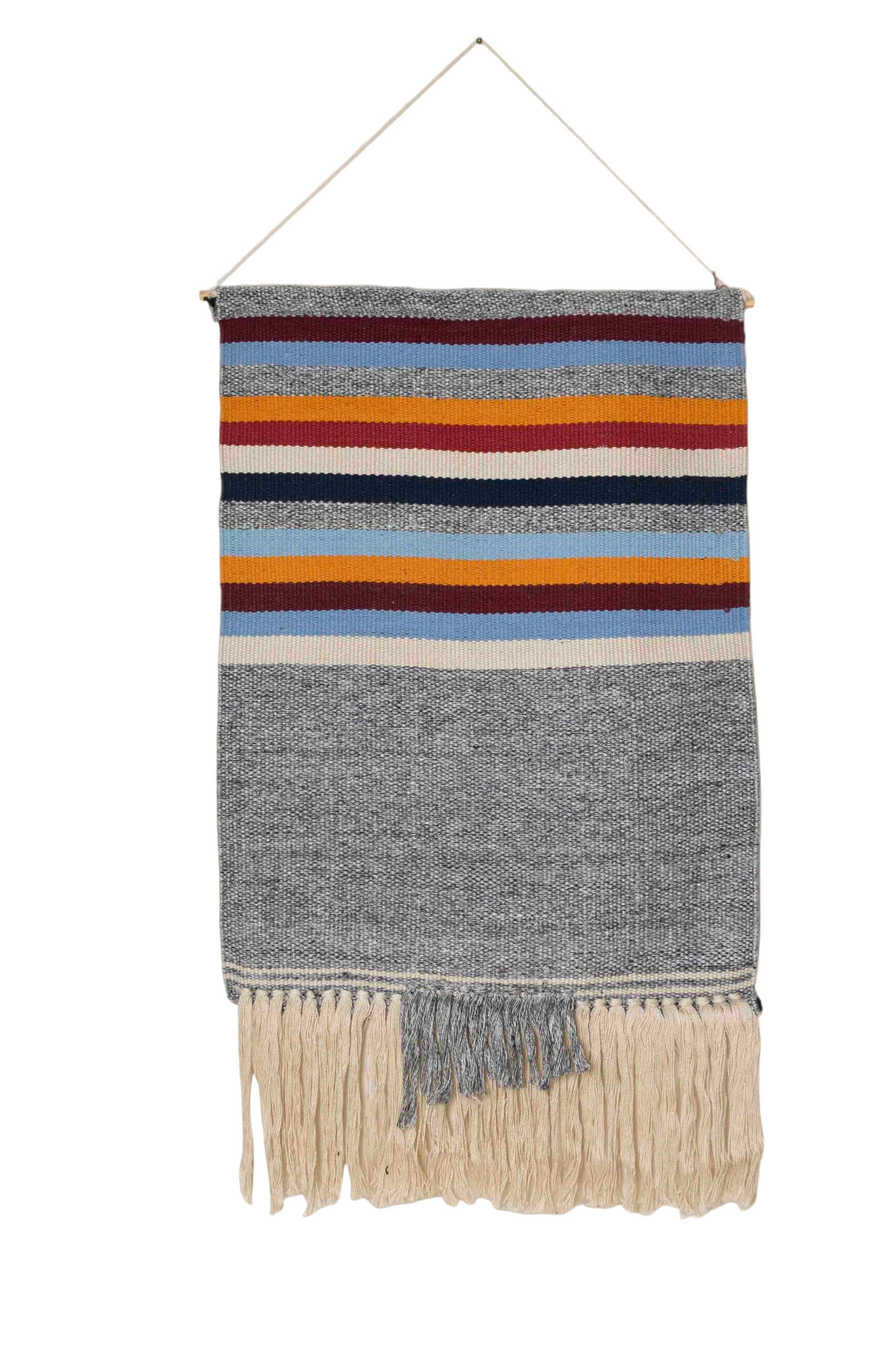 Woven wall hanging with colorful stripes and fringes on a white background