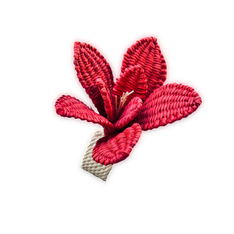Red floral napkin ring on a white background