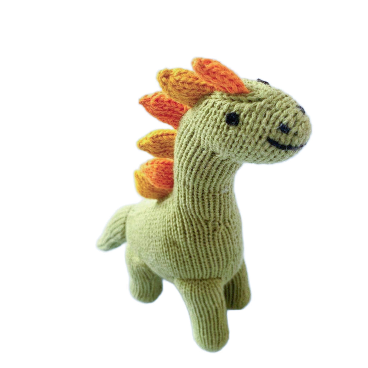 Knitted dinosaur toy with green body, orange spikes, and black eyes on a white background