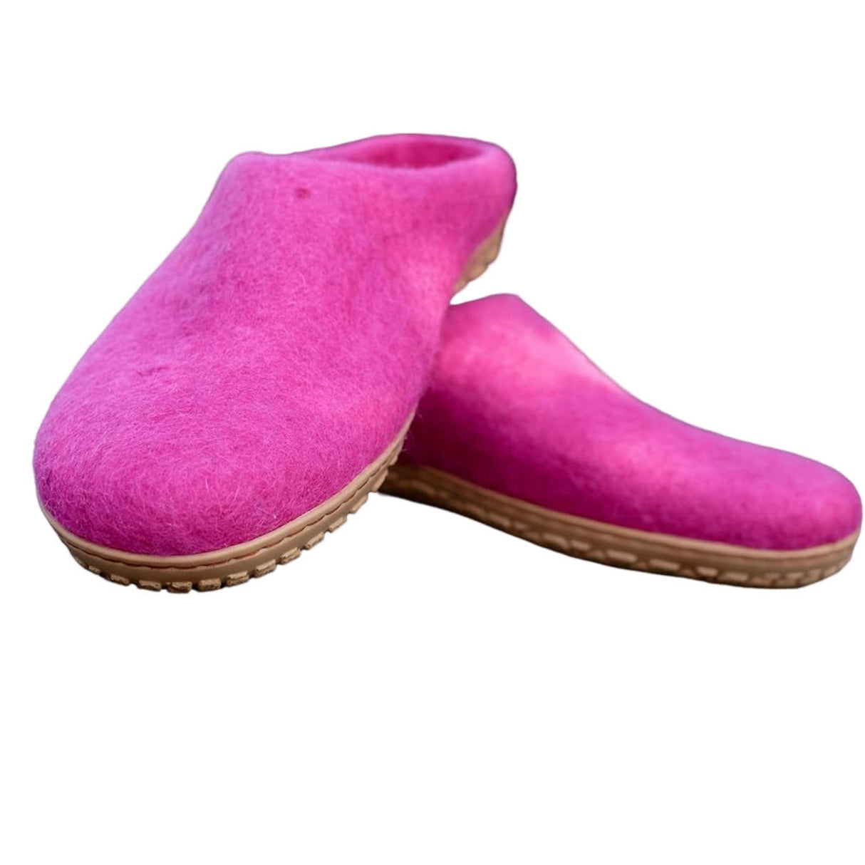 Pair of pink slippers on a white background