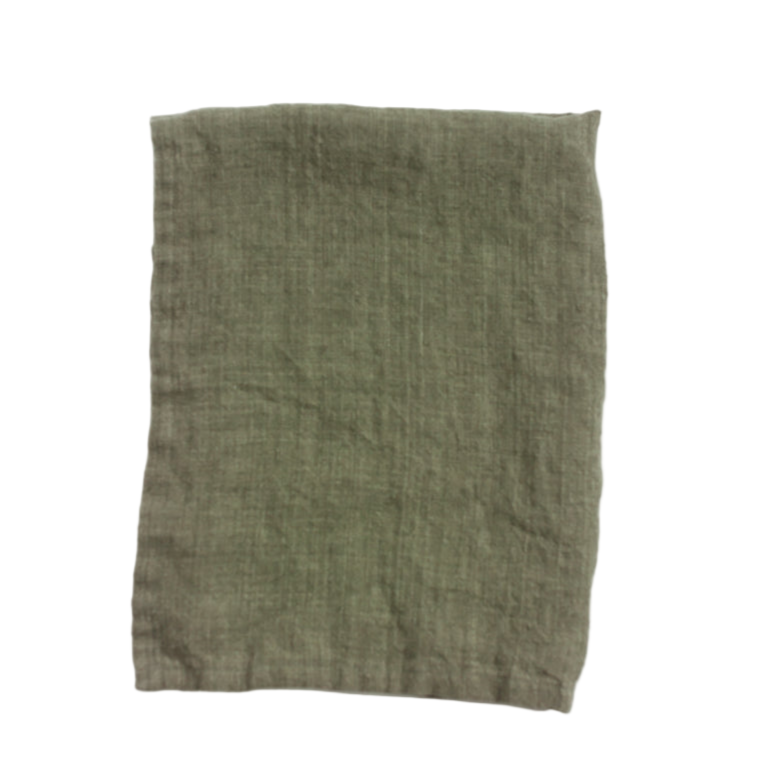 Green folded linen tea towel on a white background