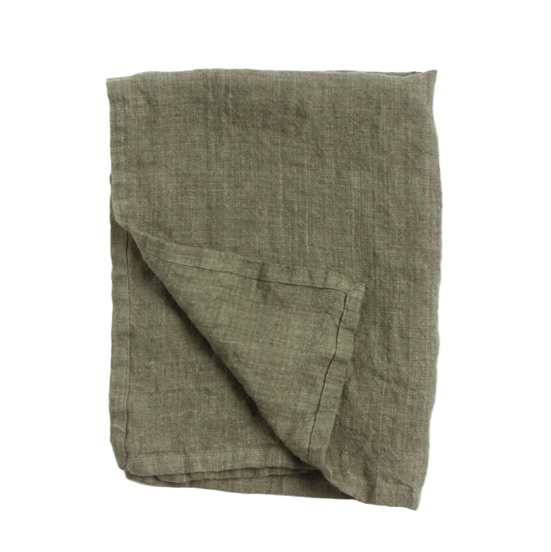 Folded green linen tea towel on a white background