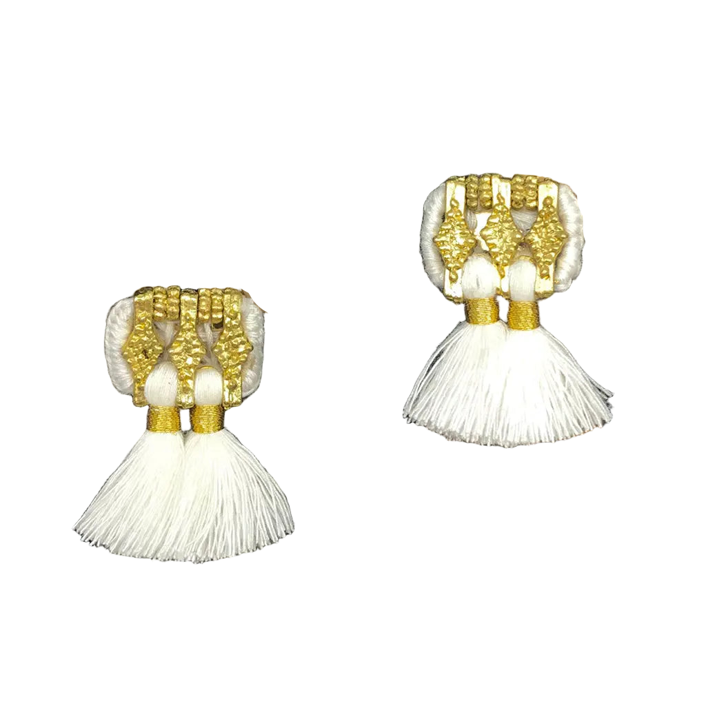 Pair of earrings with white tassels and gold accents on a white background