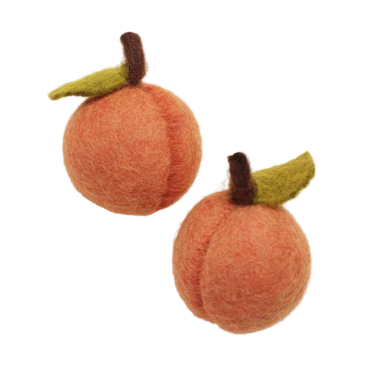 Two felted peach cat toys on a beige background