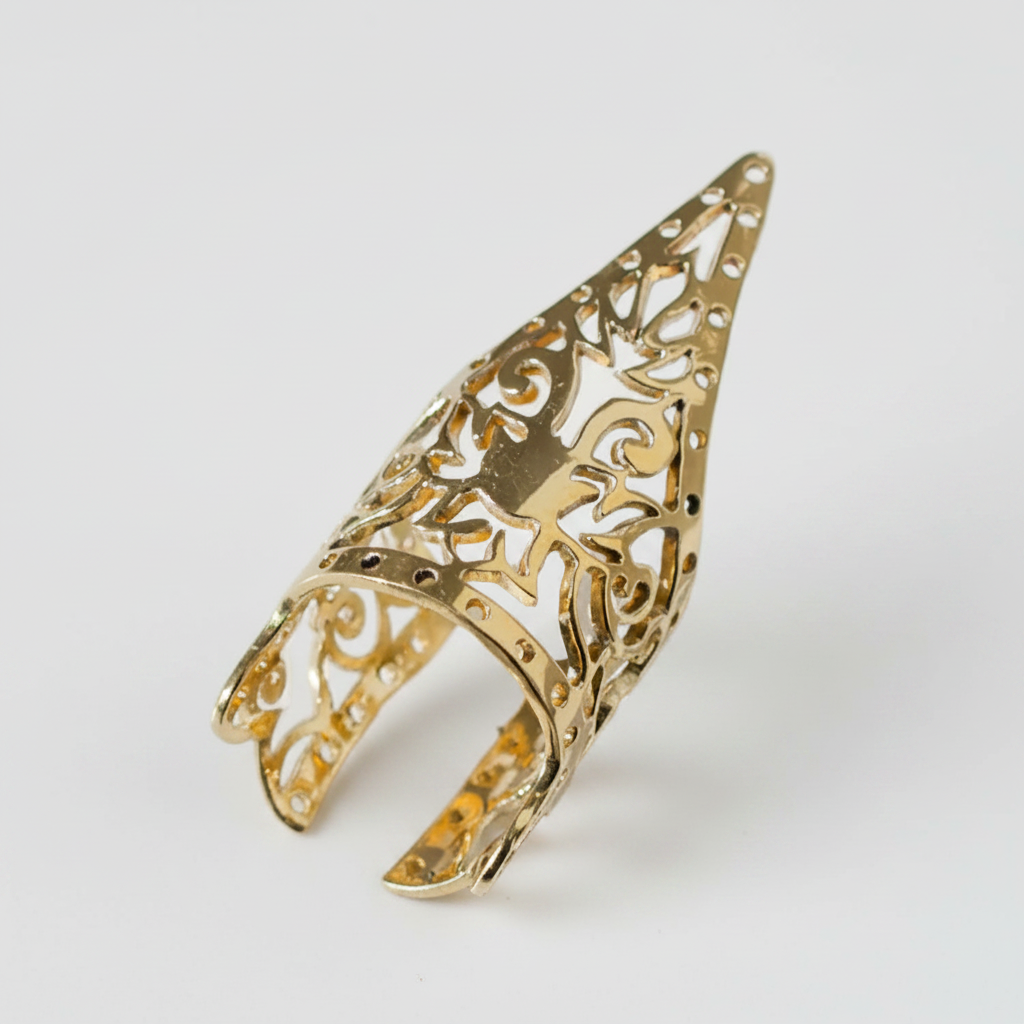 Gold openwork ring on a white background