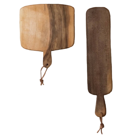 Set of four wooden cutting boards with handles on a white background