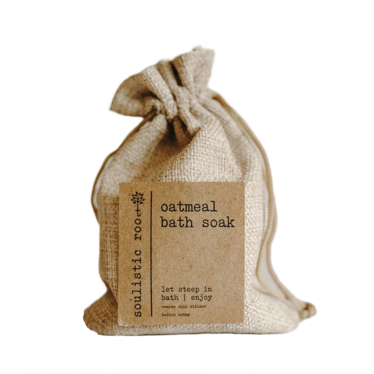 Burlap bag with oatmeal bath soak label on a white background