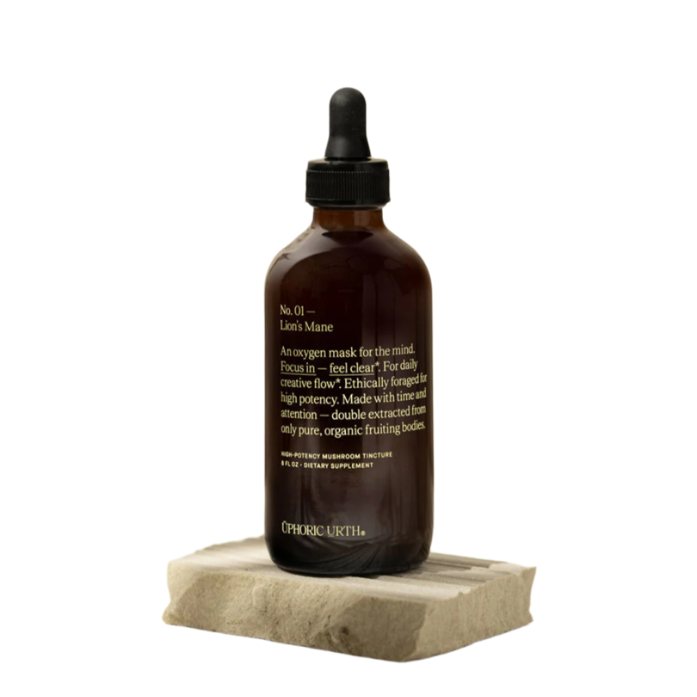 Brown glass bottle with dropper on a white background