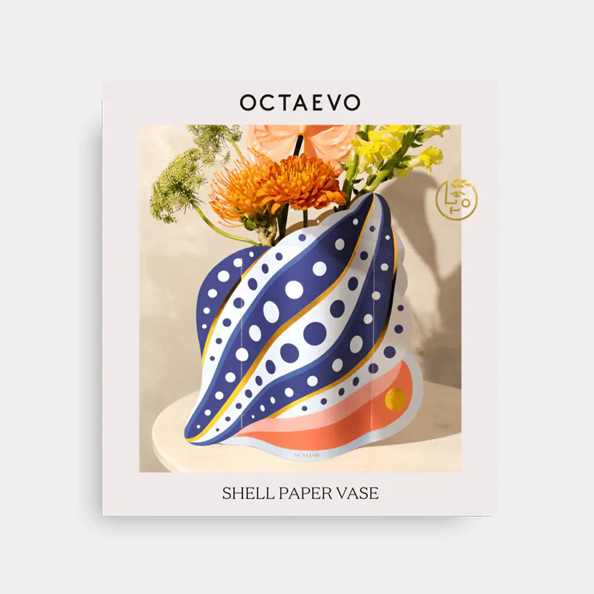 Shell-shaped paper vase with polka dot design on a light background, featuring the brand 'Octaevo'.