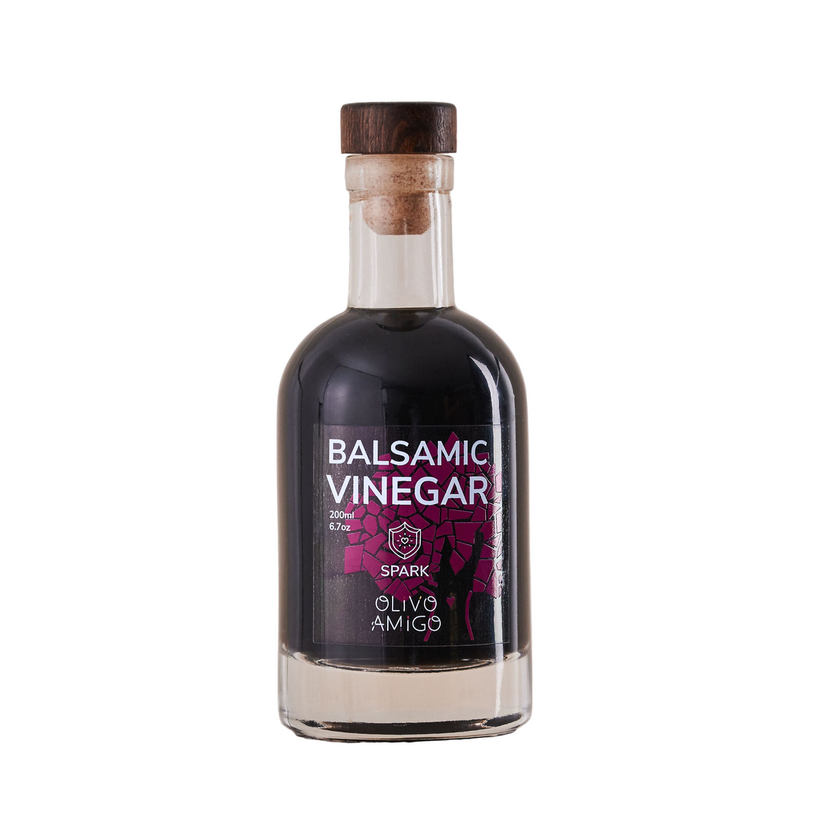 Bottle of Balsamic Vinegar with a wooden cap on a neutral background