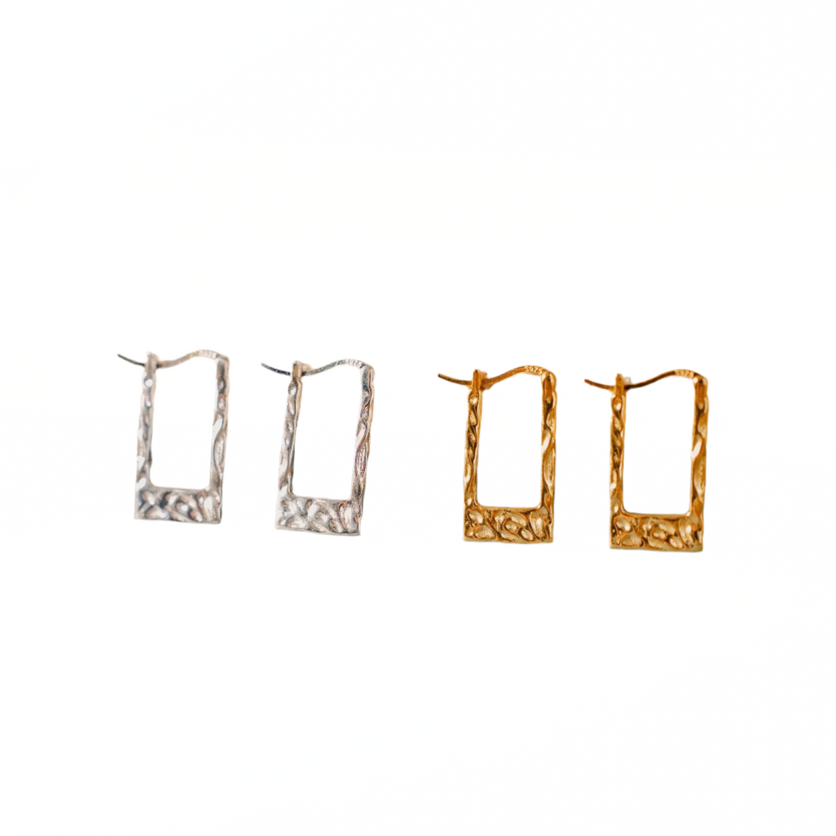 Four pairs of earrings in different designs on a white background