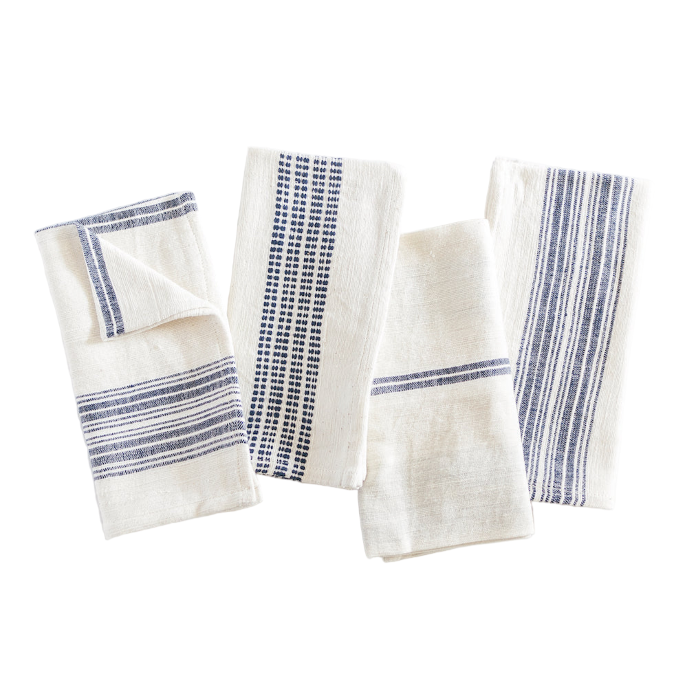 Set of four white cloth napkins with blue stripes on a white background