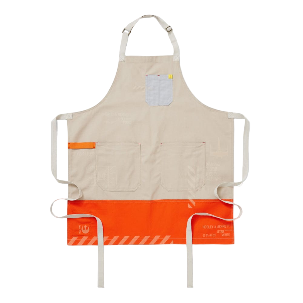 Beige apron with orange waistband and pocket on a white background