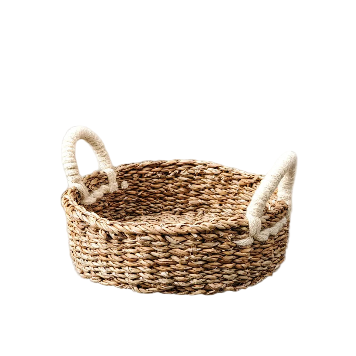 Woven basket with handles on a white background