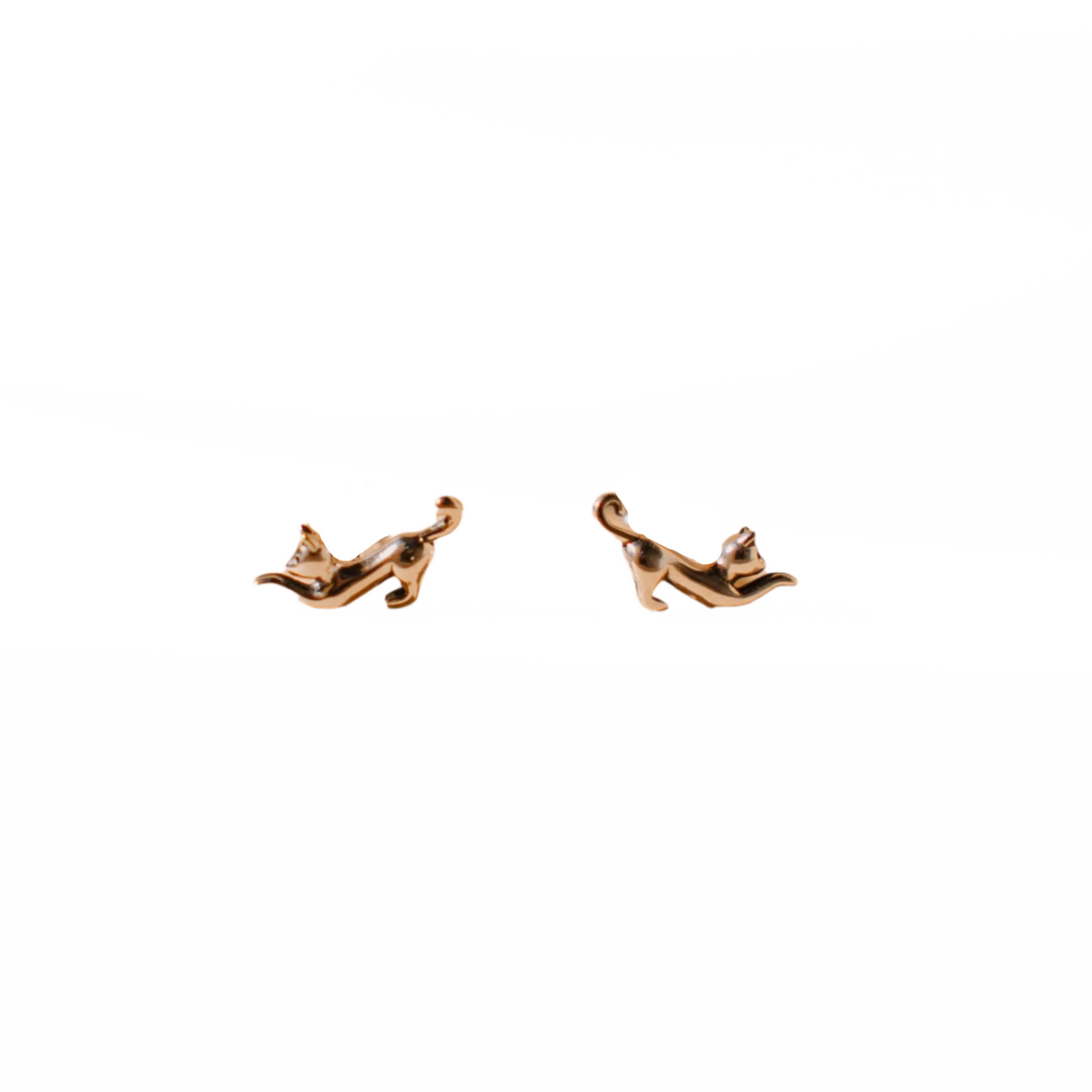 Pair of gold snail-shaped earrings on a white background