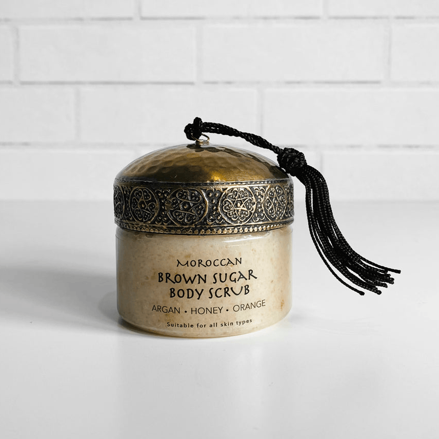 Jar of Moroccan Brown Sugar Body Scrub with decorative lid on a white background