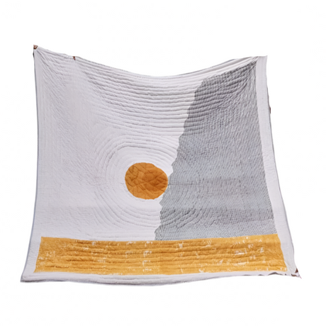 Textile with a sun and mountain design on a white background