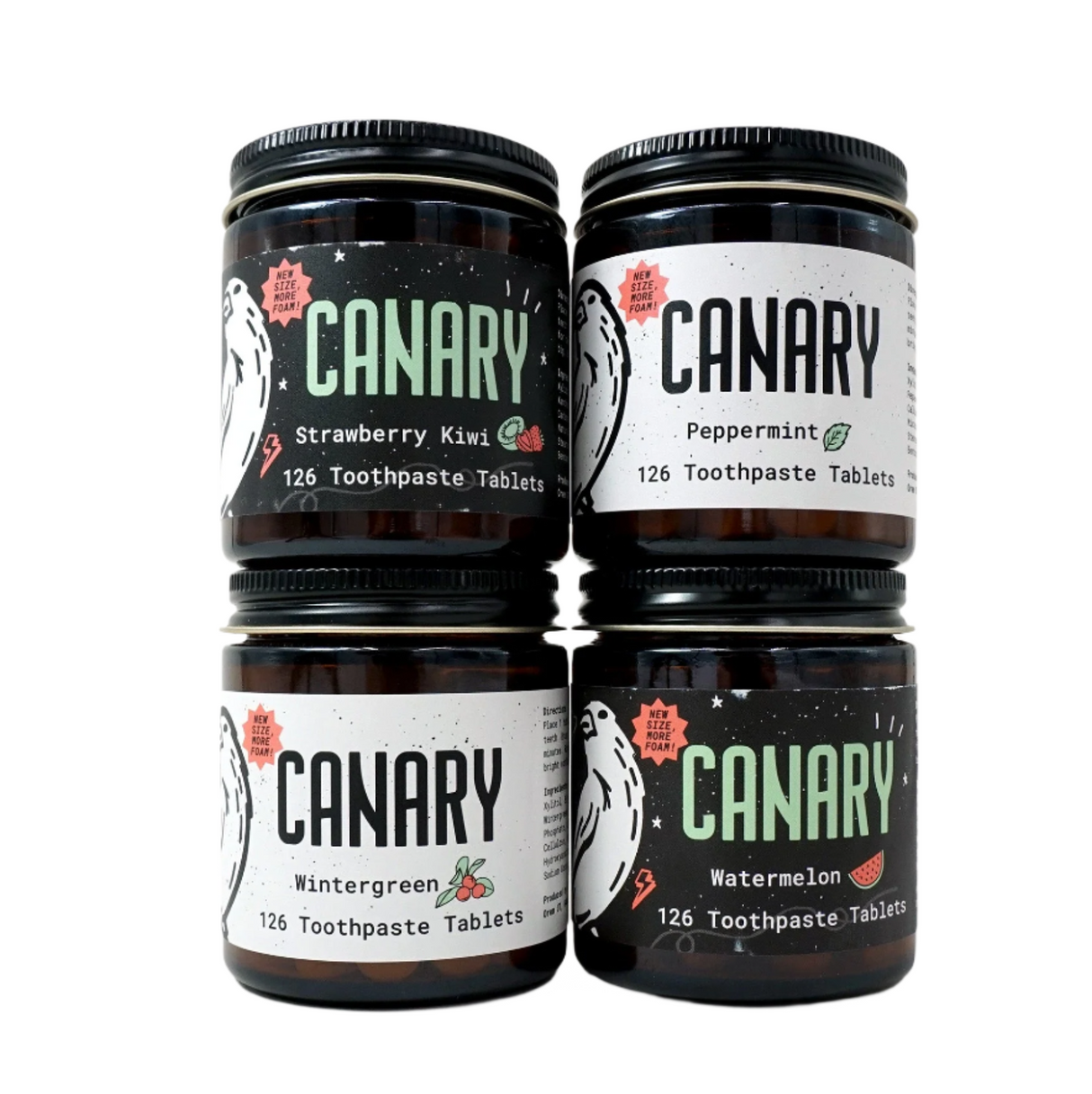 Four jars of Canary toothpaste tablets in different flavors on a white background